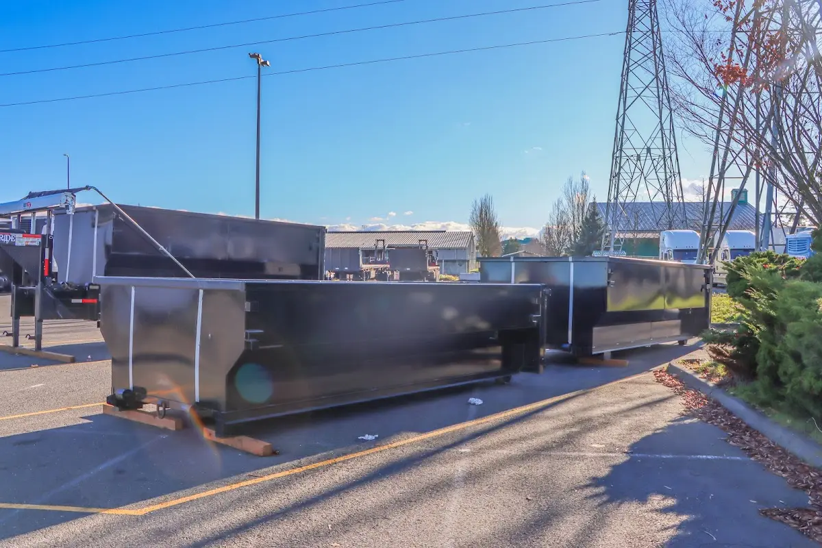 Roll-off dumpster ready for waste disposal at job site for Concrete Dumpster Rental in Chickasaw